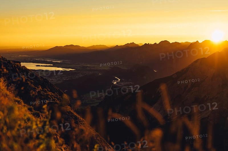 View from the Aggenstein and the foothills of the Alps in Ostallgäu and the Ammergebirge at sunrise, Bavaria, Germany, Europe