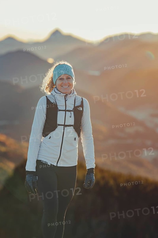 Trail running in autumn on the Jochberg on Lake Walchensee against the wonderful backdrop of the Alps, Bavaria, Germany, Europe