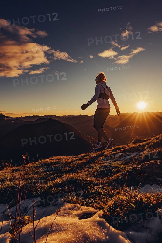 Trail running in autumn on the Jochberg on Lake Walchensee against the wonderful backdrop of the Alps, Bavaria, Germany, Europe
