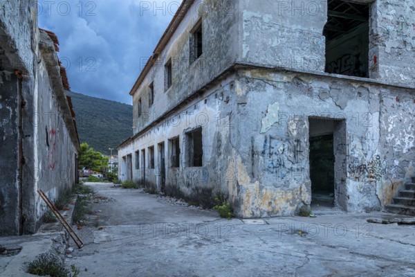 Abandoned, graffiti-covered building under a blue sky in an old town, Lost Place, Trpanj, Peljesac, Neretva, Croatia, Europe