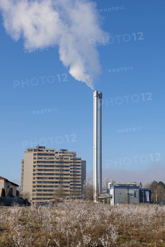 High chimney with smoke emission, residential building and frosty bushes, residential building, combined heat and power plant, district heating, Winnenden, Baden-Württemberg, Germany, Europe