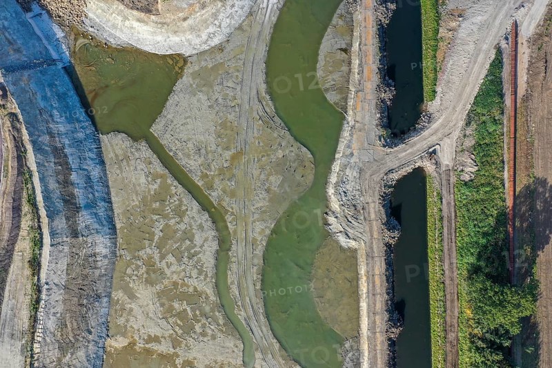 Recklinghausen, Castrop-Rauxel, North Rhine-Westphalia, Germany - EMSCHERLAND construction project, a 37-hectare water and nature discovery park at the water crossroads of the Rhine-Herne Canal and the renaturalised Emscher (right) . The ecological focal point at the confluence of Suderwicher Bach (left) and Emscher will also be a future garden for the International Garden Exhibition 2027. Before the renaturalisation, the Emscher river system was an open, above-ground wastewater channel, combined sewer with surface water and wastewater