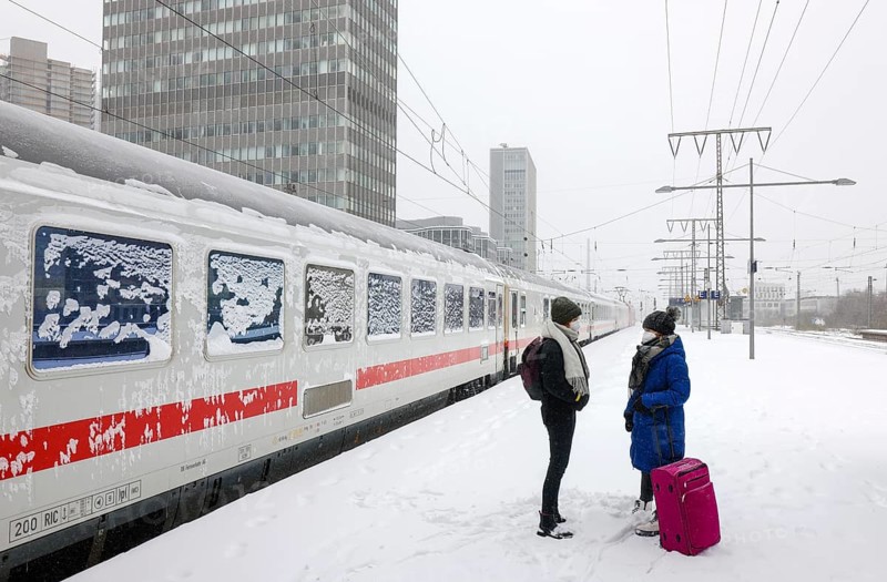 Essen, North Rhine-Westphalia, Germany - Onset of winter in the Ruhr area, Essen railway station, many trains delayed or cancelled due to ice and snow, passengers waiting for trains