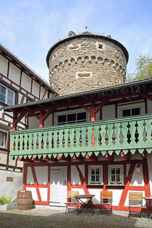Inner courtyard of tourist office and Schinderhannesturm, half-timbered house with railings and arcade, Herrstein, Hunsrück, Rhineland-Palatinate, Germany, Europe