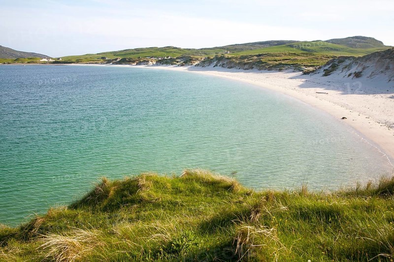 Sandy beach and aquamarine sea at Vatersay Bay, Barra, Outer Hebrides, Scotland, UK