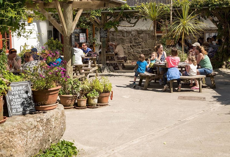 People eating ice cream at Roskilly's farm, near St Keverne, Lizard Peninsula, Cornwall, England, UK