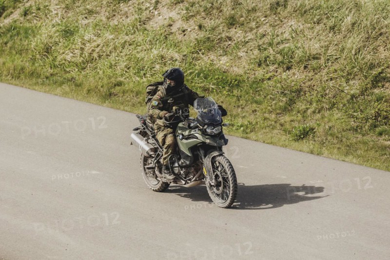A soldier on a BMW F 850 GS, photographed as part of a Bundeswehr exercise with armed forces from Norway and the Czech Republic during the 'Wettiner Schwert' exercise as part of Quadriga 2024 in the training town of Schnöggersburg, 8 April 2024