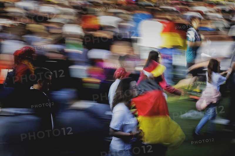 Fans react during the European Championship preliminary round match between Germany and Hungary on the fan mile in front of the Brandenburg Tor in Berlin, 19 June 2024