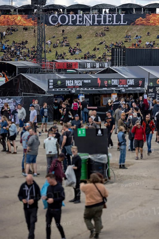 Copenhagen, Denmark - 19 June 2024: Festivalgoers in front of the logo at the Copenhell Metal Festival at Kløverparken Camping Copenhagen, Denmark. The festival will take place from 19-22 June 2024
