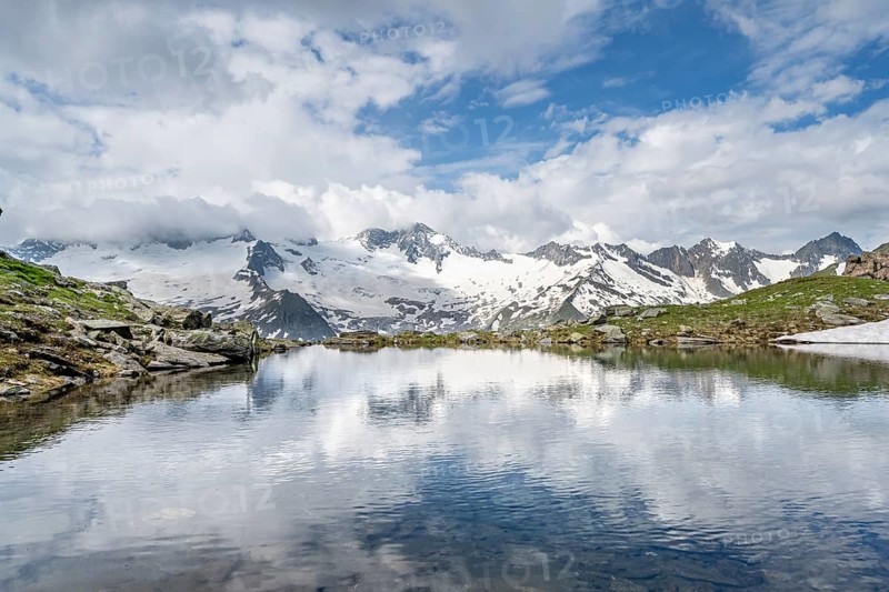 Picturesque mountain landscape with mountain lake, mountains and glaciers reflected in the Schwarzsee, Hornkees and Waxeggkees glaciers with Großer Möseler peak, Berliner Höhenweg, Zillertal Alps, Tyrol, Austria, Europe