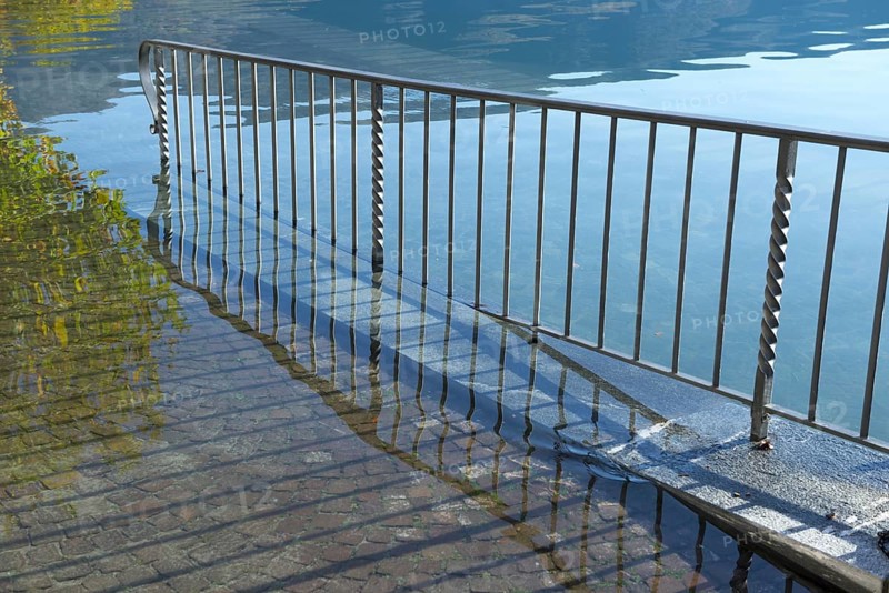 Street with Railing on Flooding lake Maggiore on the Waterfront in a Sunny Day with Sunlight in Ascona, Ticino, Switzerland, Europe