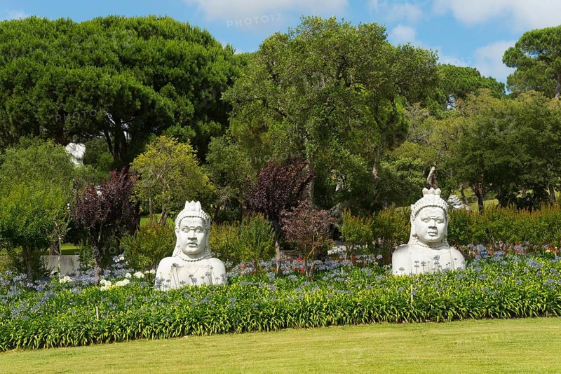 Two Buddha statues in a green, peaceful garden with numerous trees and bushes, Bacalhôa, Bacalhoa Buddha Eden, Quinta dos Loridos, largest oriental garden in Europe, Bombarral, Oeste, Centro, Portugal, Europe