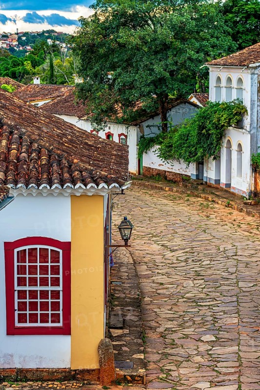 Stone-paved street and old colonial houses in the city of Tirandentes in Minas Gerais, Tiradentes, Minas Gerais, Brazil, South America