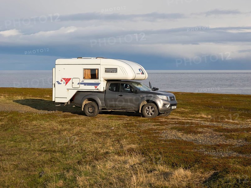 Mobile Camper parked near the Arctic Ocean shore, May, Varanger Fjord, Norway, Europe