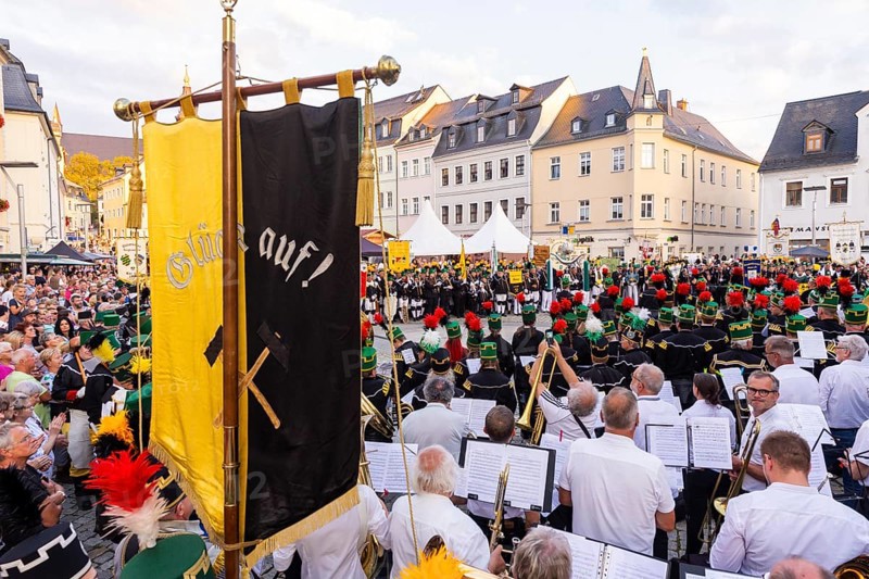 The so-called Bergstreittag is a beautiful centuries-old tradition and is celebrated on 22 July, the church memorial day and former feast day of Mary Magdalene in Schneeberg. The four quarterly sermons introduced in 1649 remained in place until 1845. These sermons were then abolished in favour of a single day, 22 July, which fell on Mary Magdalene. The Freiberg Mining Office recommended that this day should be celebrated with a festival and a mountain parade. In 1846, the Royal Ministry of Finance issued a decree to celebrate St Mary Magdalene's Day with a sermon and a magnificent mountain procession. The last major procession took place in July 1913. The First World War put an end to these processions. The tradition was not revived until July 1933, 528th Bergstreittag, closing ceremony with concert on the market square, Schneeberg, Saxony, Germany, Europe