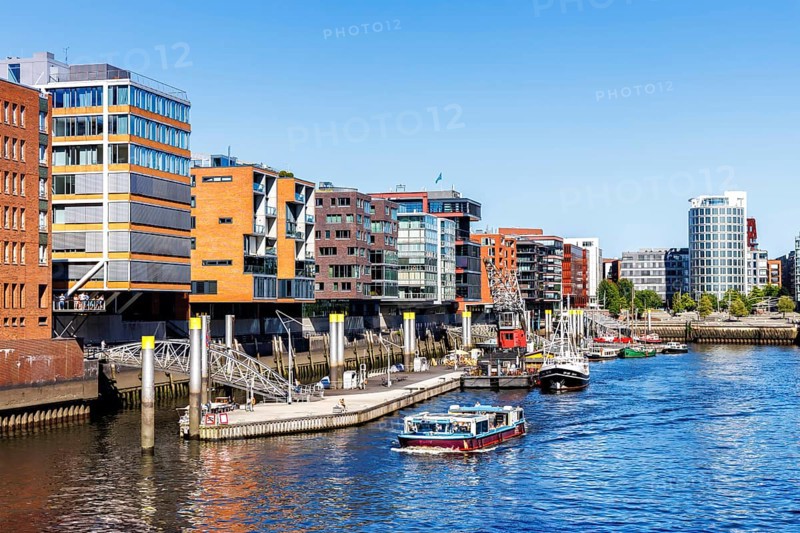 Building in the HafenCity Sandtorhafen harbour with boats in Hamburg, Germany, Europe