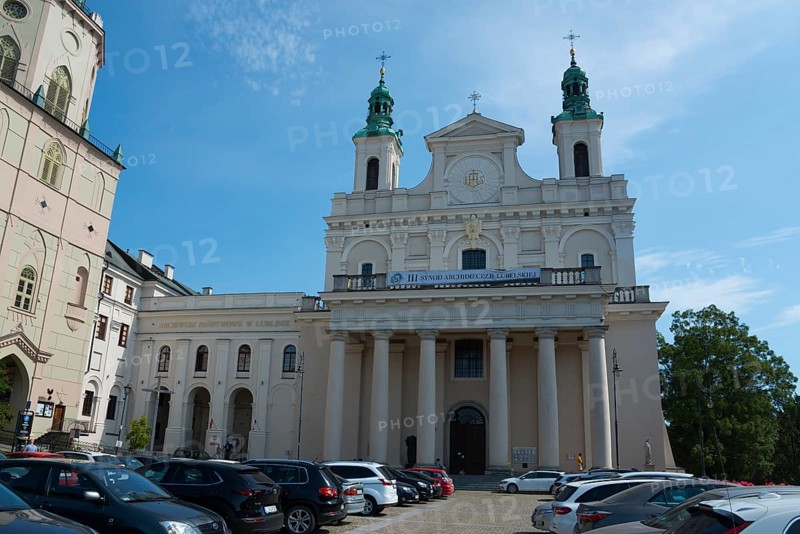 Large church with columned façade and parked cars in front, St John's Cathedral, Lublin, Poland, Europe