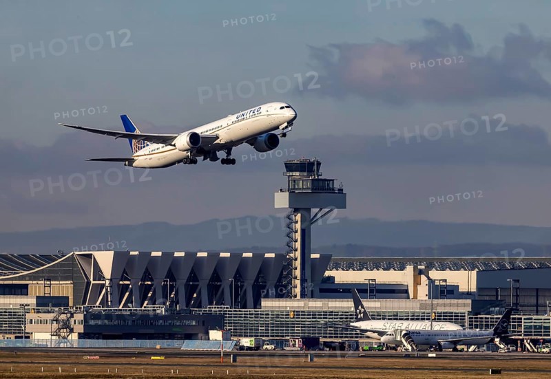 Aircraft taking off in front of the hangar and tower at Fraport Airport. Aircraft registration number: N12003, Boeing 787 Dreamliner, United Airlines. Frankfurt am Main, Hesse, Germany, Europe