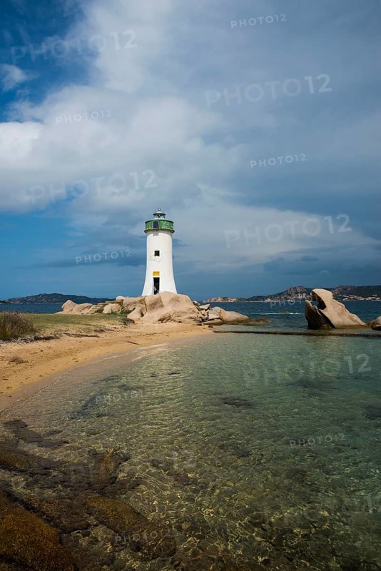 Lighthouse with beach and bizarre granite rocks, Spiaggia Porto Faro, Faro di Punta Palau, Palau, Costa Smeralda, Sardinia, Italy, Oceania