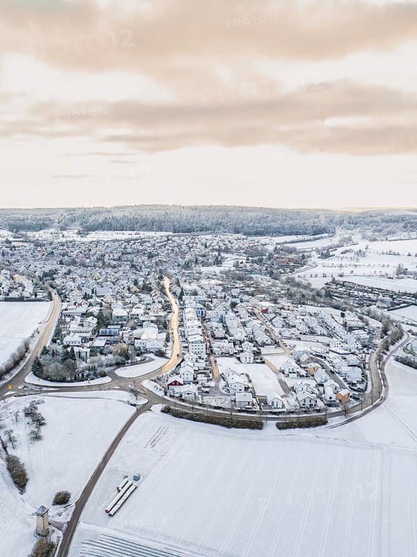 Snow-covered small village surrounded by open fields, Calw- Stammheim, Black Forest, Germany, Europe