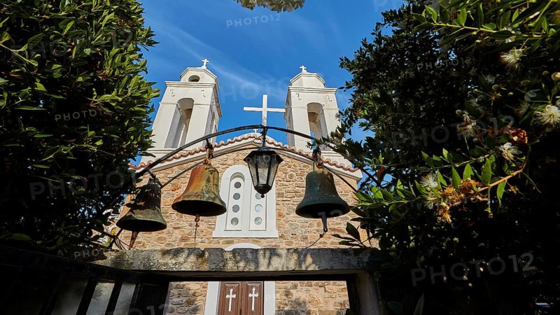 Three church bells in front of a stone wall under a deep blue sky, Koroni, Byzantine fortress, nunnery, Peloponnese, Greece, Europe