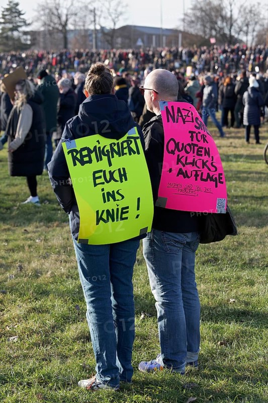 Demonstrators with banner on the topic of remigration, large demonstration against right-wing extremism and AfD on 27 January 2024 in Düsseldorf, North Rhine-Westphalia, Germany, Europe