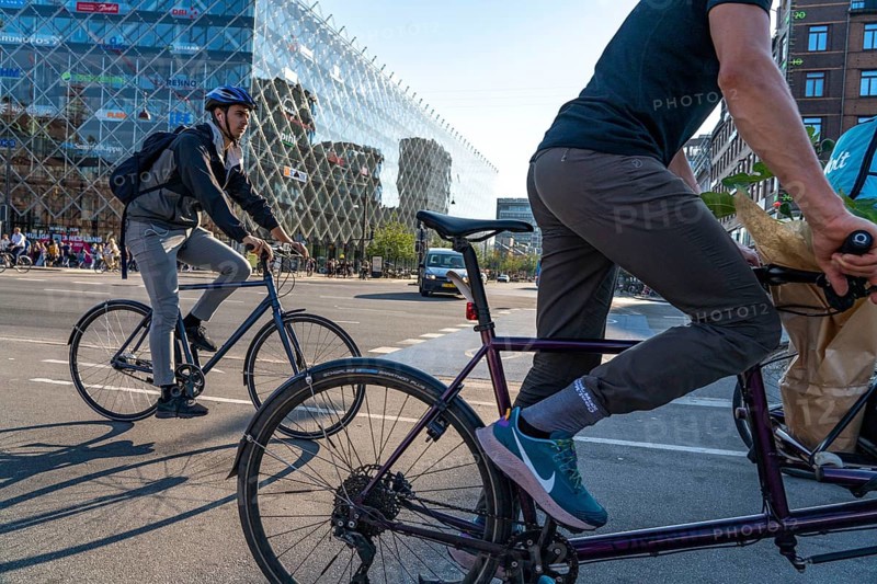 Cyclists on cycle paths, Radhuspladsen, City Hall Square, H.C. Andersen's Boulevard, in the city centre of Copenhagen, considered the cycling capital of the world, 45% of the population travel by bike, Denmark, Europe