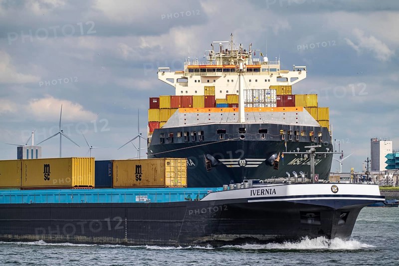 Europahaven, MSC Laura container freighter being towed by harbour tugs, seaport of Rotterdam, inland vessel, container freighter, deep-sea port Maasvlakte 2, on an artificial land area, Netherlands