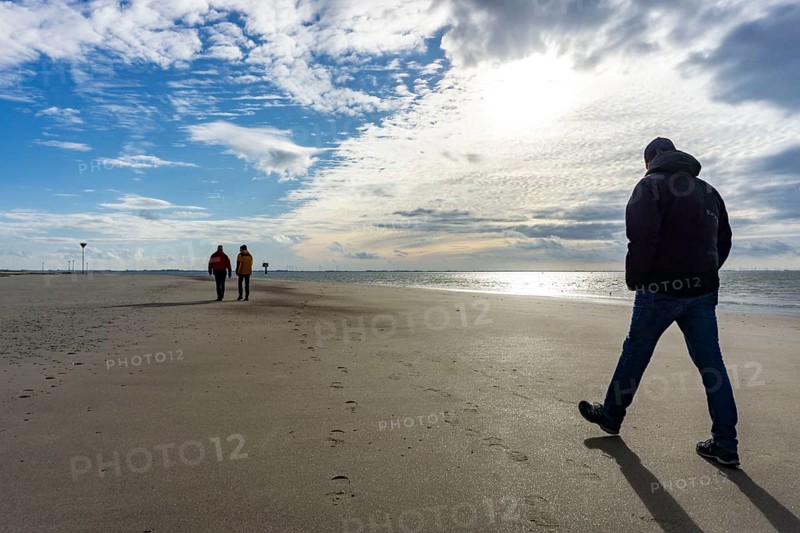 North Sea, Spiekeroog Island, autumn, strong wind drives the sand over the mudflats at low tide, beach walker, west coast of the East Frisian Island, Lower Saxony, Germany, Europe