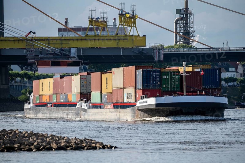 Inland navigation on the Rhine near Duisburg, container ship Hollande, fully loaded, Rhine bridge Neuenkamp, motorway A40, North Rhine-Westphalia, Germany, Europe