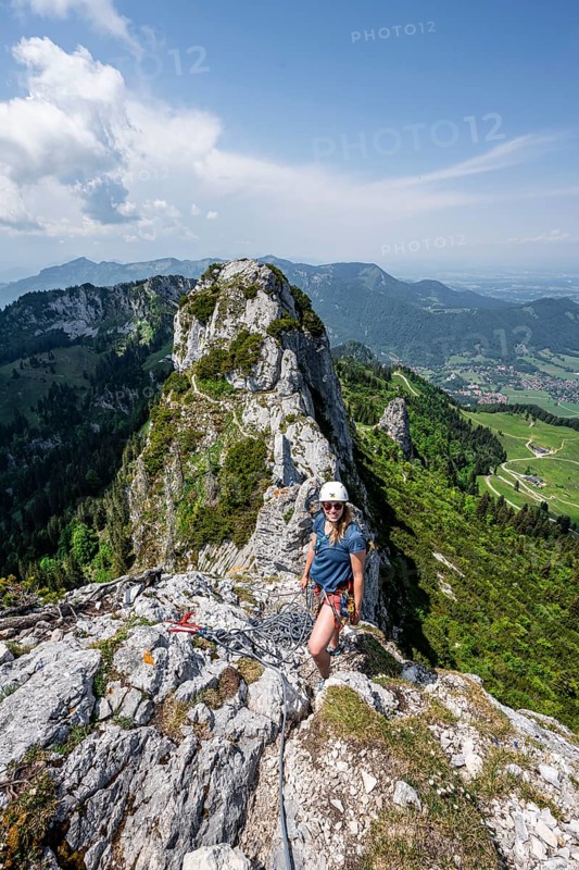 Climber with climbing rope on a climbing tour, climber on a mountain ridge, alpine climbing, crossing the Kampenwand, Chiemgau, Bavaria, Germany, Europe