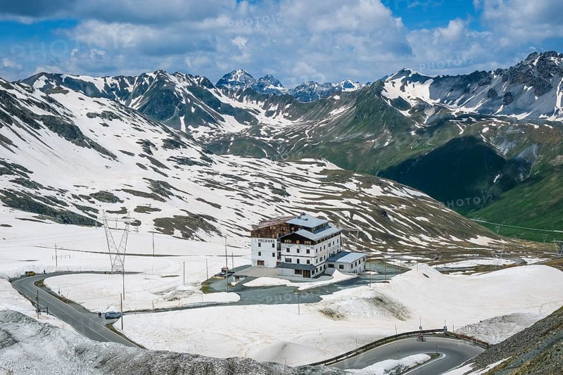 Stilfserjoch, Vinchgau, South Tyrol, Italy, Hotel Folgore on the Stilfser Joch pass road, rest area with catering, restaurants and hotels at the top of the pass road, snow-covered mountain landscape of the Swiss Alps in the background, Europe