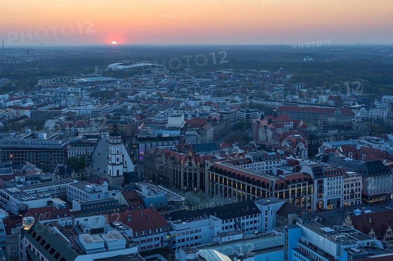 View of the city from the City Tower at sunset, St Thomas' Church, Red Bull Arena and Auwald forest, Leipzig, Saxony, Germany, Europe