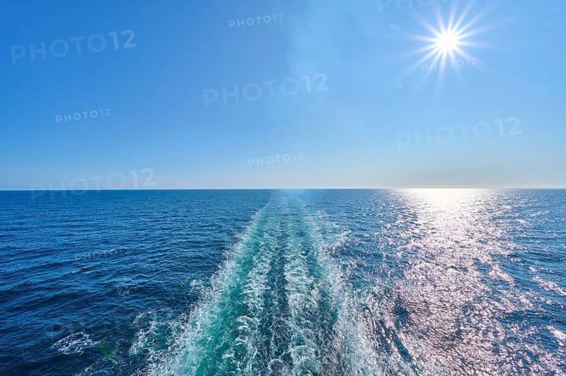 View from the stern of the ship, Mein Schiff 6, onto the fairway, blue sky and bright sunshine, North Sea, Norway, Europe