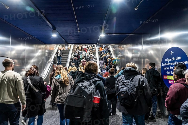 Public transport, underground, main station exit, many people crowding out of the underground station at rush hour in the afternoon, via stairs and escalators, North Rhine-Westphalia, Germany, Europe