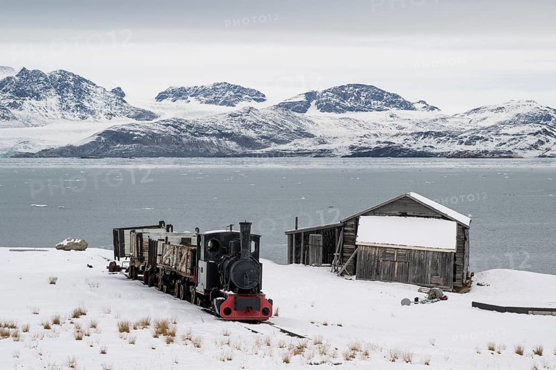 Historic mine railway in winter landscape, Kongsfjord, Ny-Ålesund, Spitsbergen Island, Svalbard and Jan Mayen archipelago, Norway, Europe