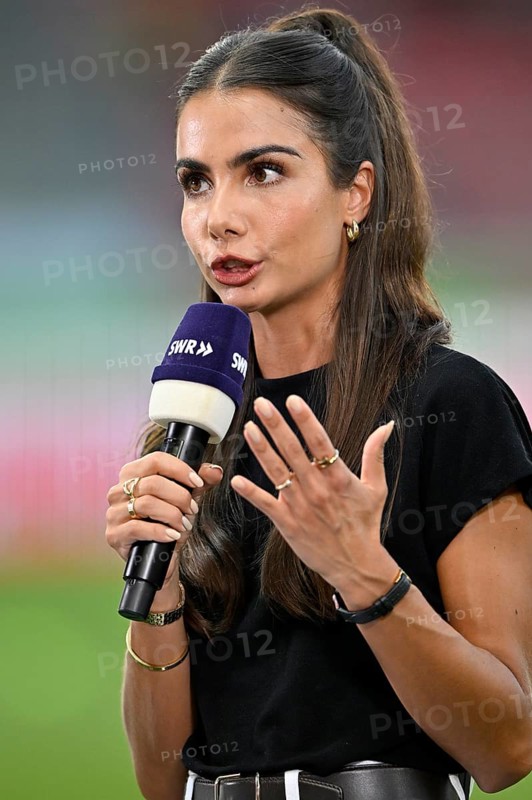 TV presenter Lea Wagner in an interview, microphone, logo, SWR, gesture, Voith-Arena, Heidenheim, Baden-Württemberg, Germany, Europe