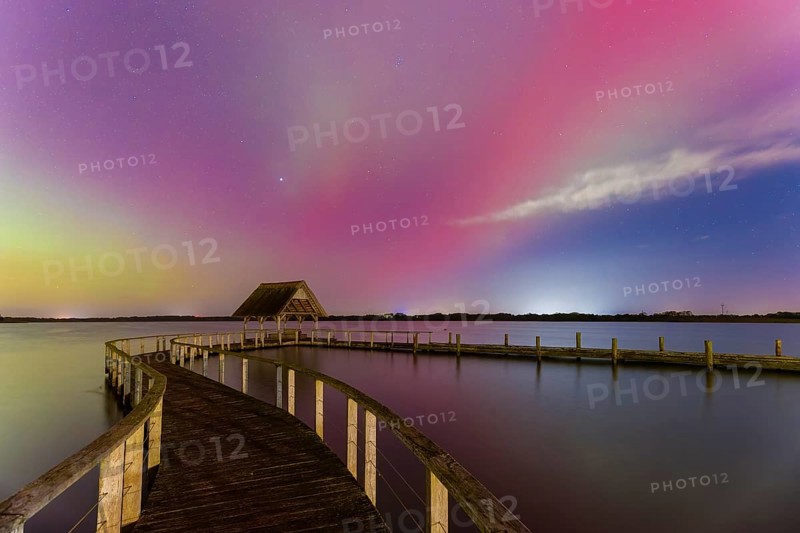 Wooden jetty and Northern Lights, Aurora borealis, polar lights over Lake Hemmelsdorf, Hemmelsdorfer See near Lübeck, Schleswig-Holstein, Germany, Europe