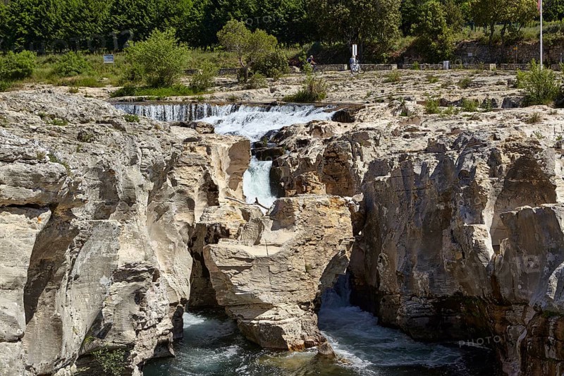 The cascades of Sautadet with limestone cliffs and the river Cèze in La Roque-sur-Cèze, Département Gard, Occitanie region, France, Europe
