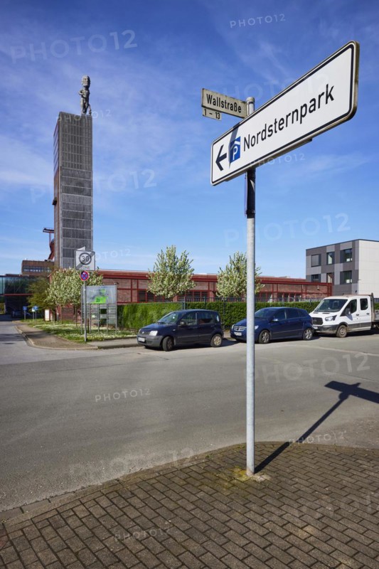 Signpost to Nordsternpark and winding tower of Nordstern colliery in Nordsternpark, Gelsenkirchen, Ruhr area, independent city, North Rhine-Westphalia, Germany, Europe