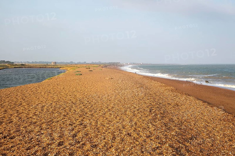 North Sea coastline view of shingle ridge and lagoon on beach bar, Shingle Street, East Lane, Bawdsey, Suffolk, England, UK