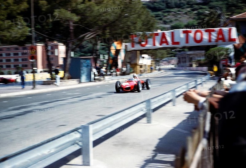 Formula 1 race Monaco Grand Prix 1961, Ferrari 156 F1 with shark nose passing the pits, motion blur which is supposed to be from Trips