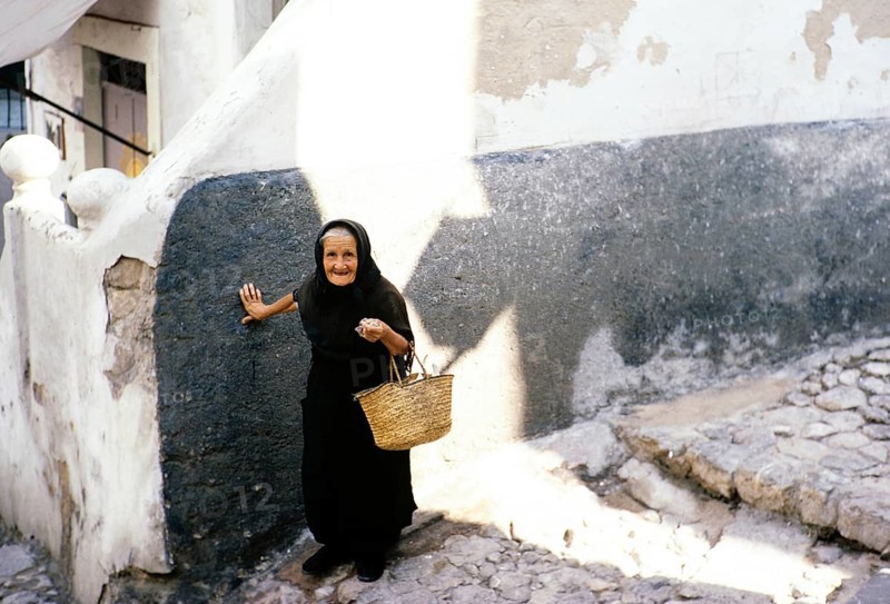 Old widow in black clothes in Ibiza Town, Ibiza, Balearic Islands, Spain 1967