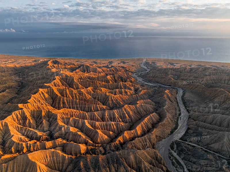 Landscape of eroded hills at Lake Issyk Kul, Badlands at sunrise, aerial view, Canyon of the Forgotten Rivers, Issyk Kul, Kyrgyzstan, Asia