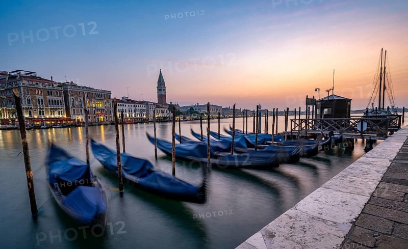 Venetian gondolas, boat dock at the customs office on the Grand Canal, Gondola Traghetto Dogana, Campanile behind, long exposure at sunrise, Venice, Veneto, Italy, Europe