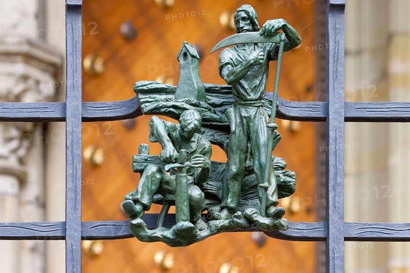 Prague castle, Gothic Metropolitan Cathedral of Saints Vitus, Wenceslas and Adalbert, Decorative figure of daily life scene on a fence, Prague, Czech Republic, Europe