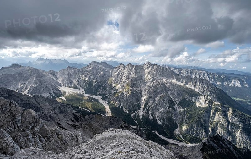 View of Wimbachgries valley and mountain panorama with rocky mountain peak of Hochkalter, at Watzmann Hocheck summit, Berchtesgaden National Park, Berchtesgaden Alps, Bavaria, Germany, Europe
