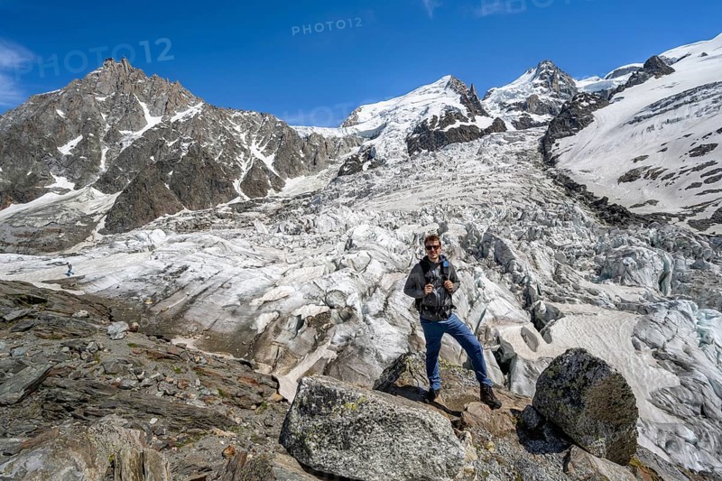 Mountaineers on the glacier, High alpine glaciated mountain landscape, La Jonction, Glacier des Bossons meets Glacier de Taconnaz, Summit of the Aiguille du Midi, Mont Maudit and Mont Blanc, Chamonix, Haute-Savoie, France, Europe