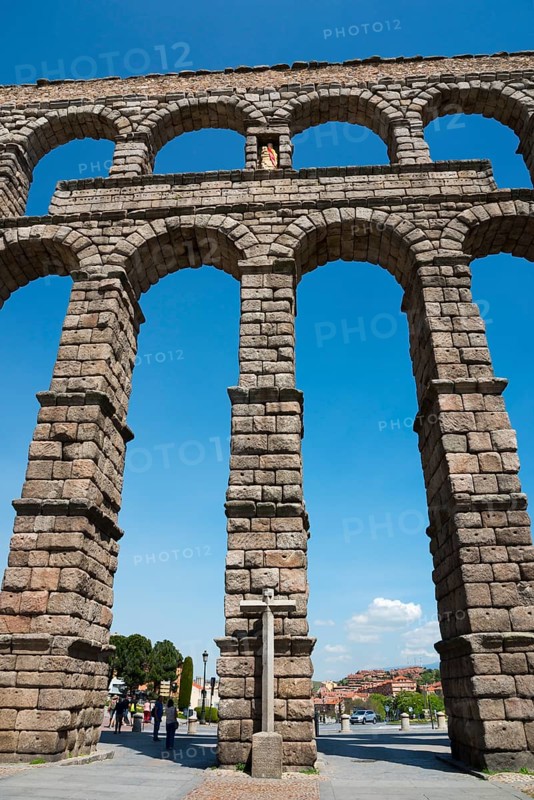 A majestic ancient aqueduct under a clear blue sky, with detailed stone arches, Aqueduct, Segovia, Castilla y León, Leon, Spain, Europe