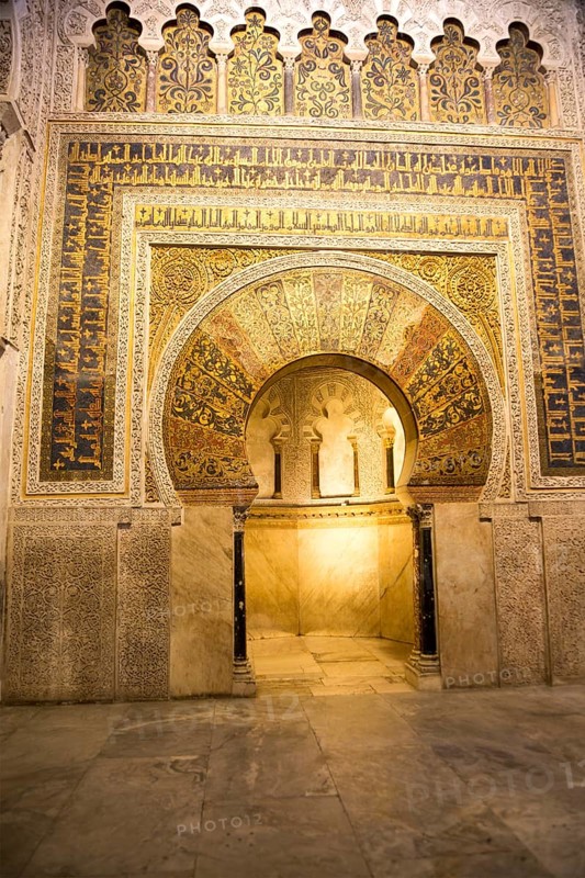 Richly inscribed stonework of keyhole shaped Mihrab, the centrepiece of the Great Mosque, Cordoba, Spain, Europe